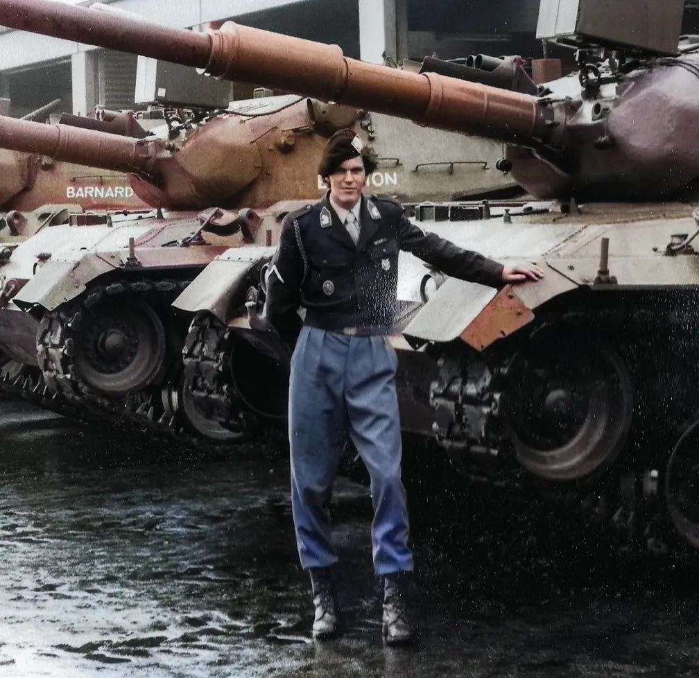 image of Patriot energy drink founder Eric van Duyn leaning on his Leopard I tank in 1980