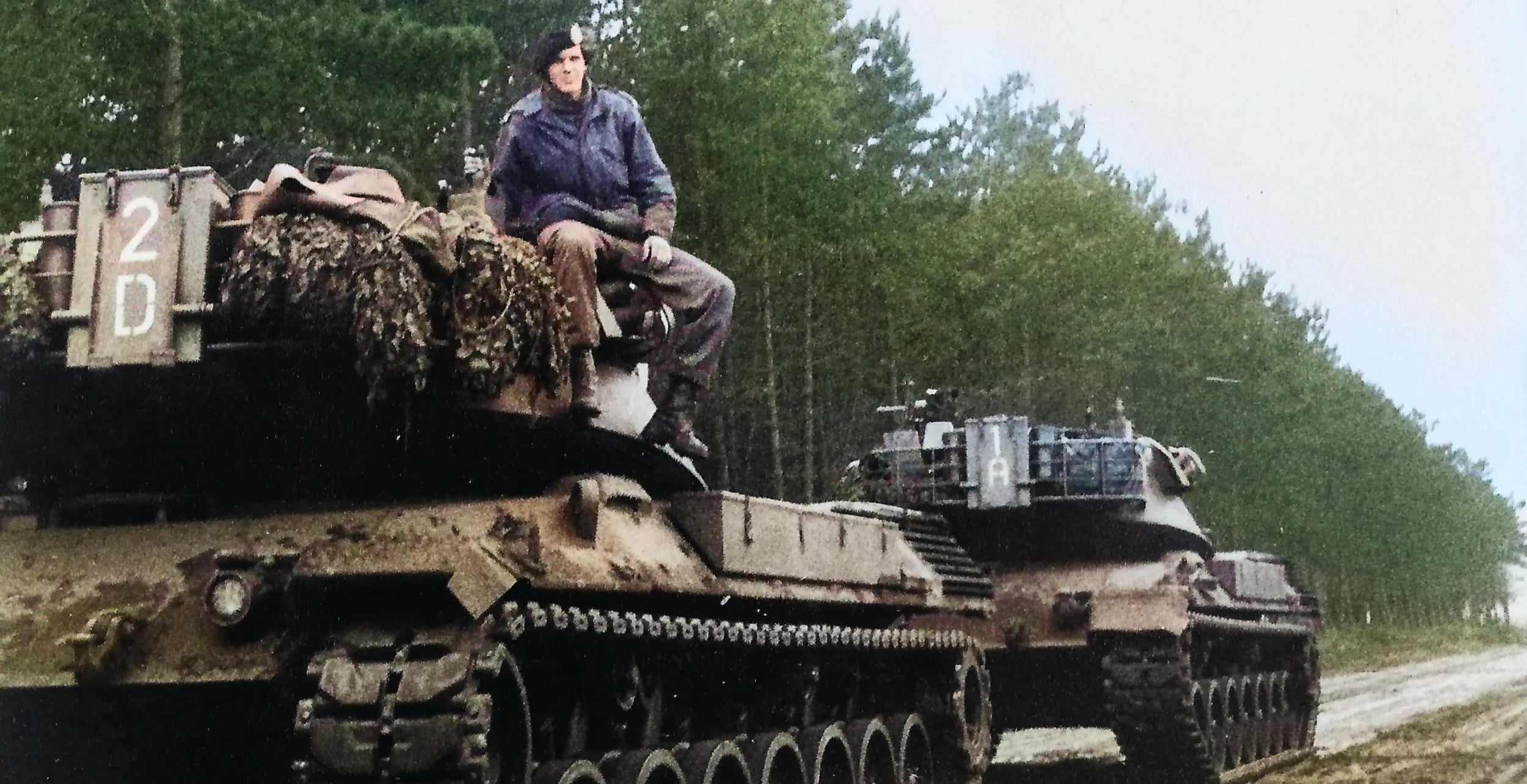 image of Patriot energy drink founder Eric van Duyn sittion on top his Leopard I tank in 1981